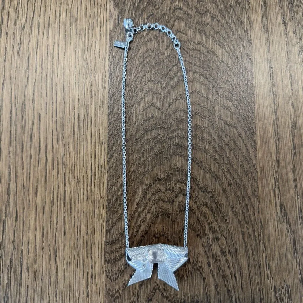 Kate Spade All Wrapped Up Silver Tone Ribbed Grosgrain Ribbon Bow Necklace Charm